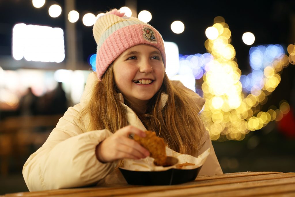 Young girl eating food